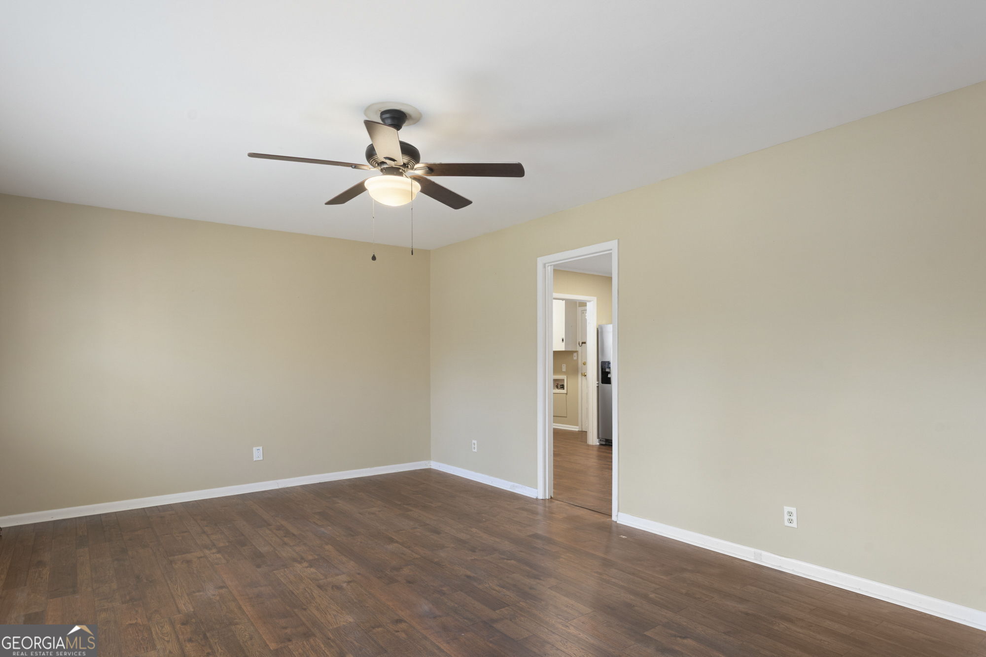 1423 Tucker Road Perry, GA 31069 - Photo 3 of 37 a view of a room with wooden floor and a ceiling fan