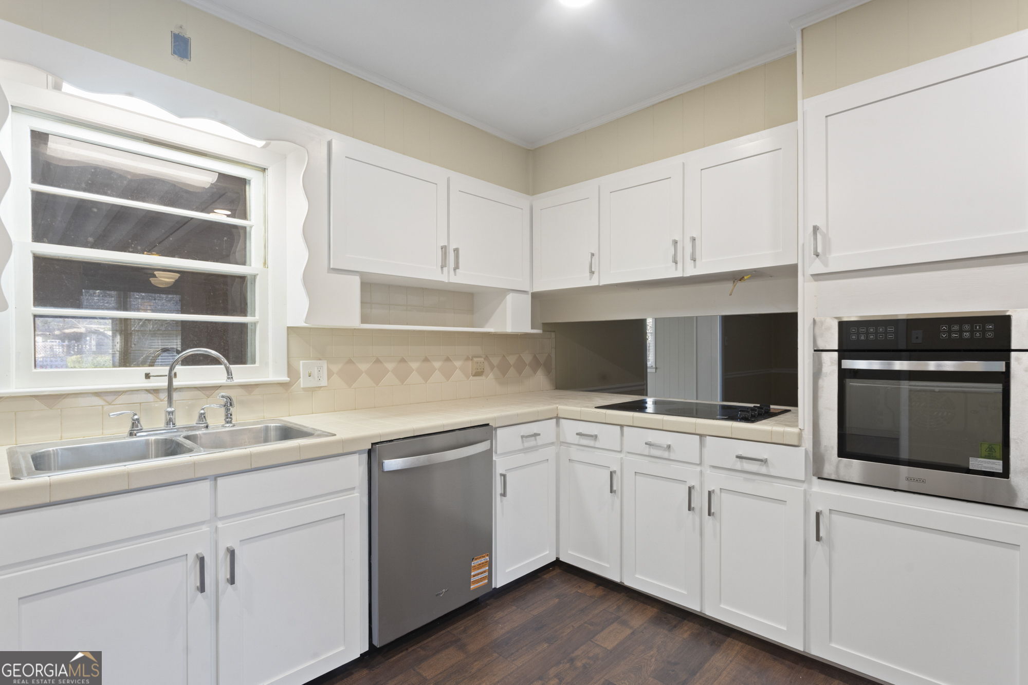 1423 Tucker Road Perry, GA 31069 - Photo 4 of 37 a kitchen with appliances cabinets and a sink