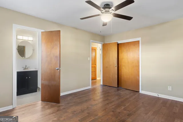 a view of an empty room with a fan