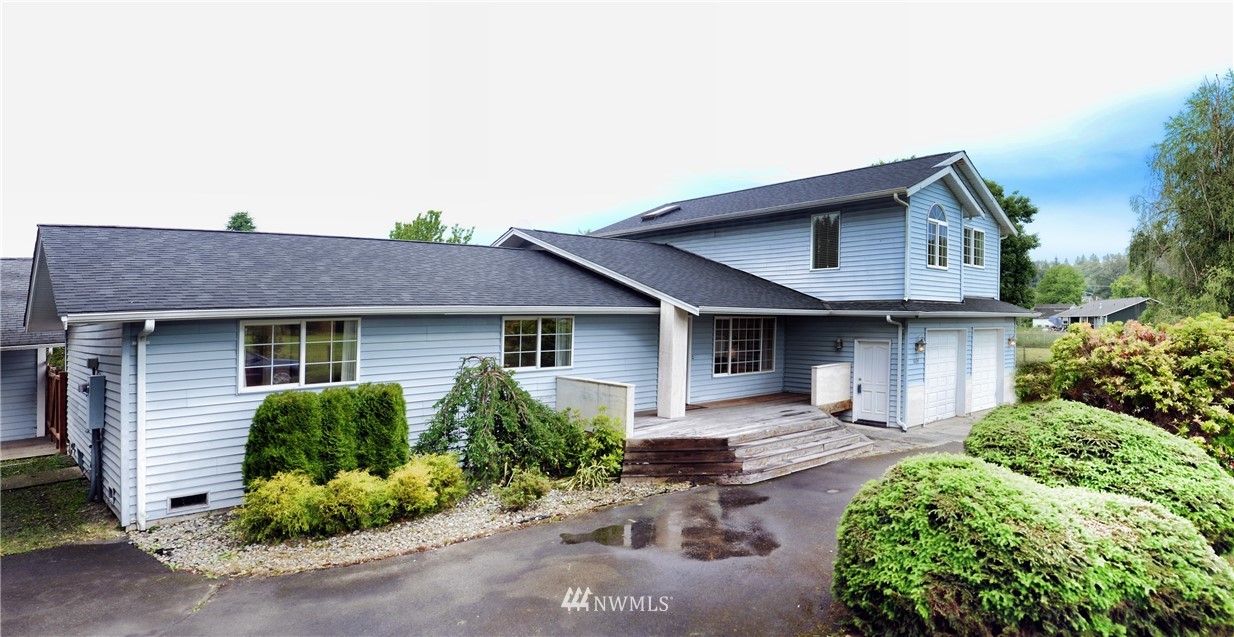 1024 South Machias Road Snohomish, WA 98290 - Photo 1 of 36 a front view of a house with a yard