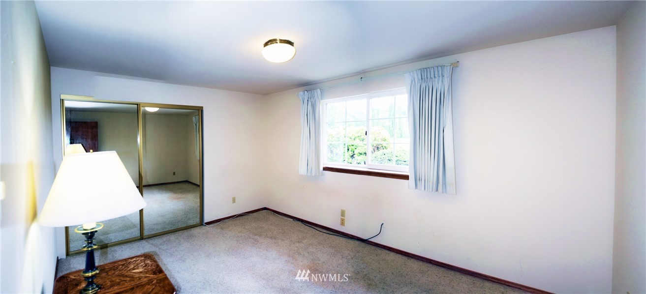 1024 South Machias Road Snohomish, WA 98290 - Photo 22 of 36 an empty room with windows and closet
