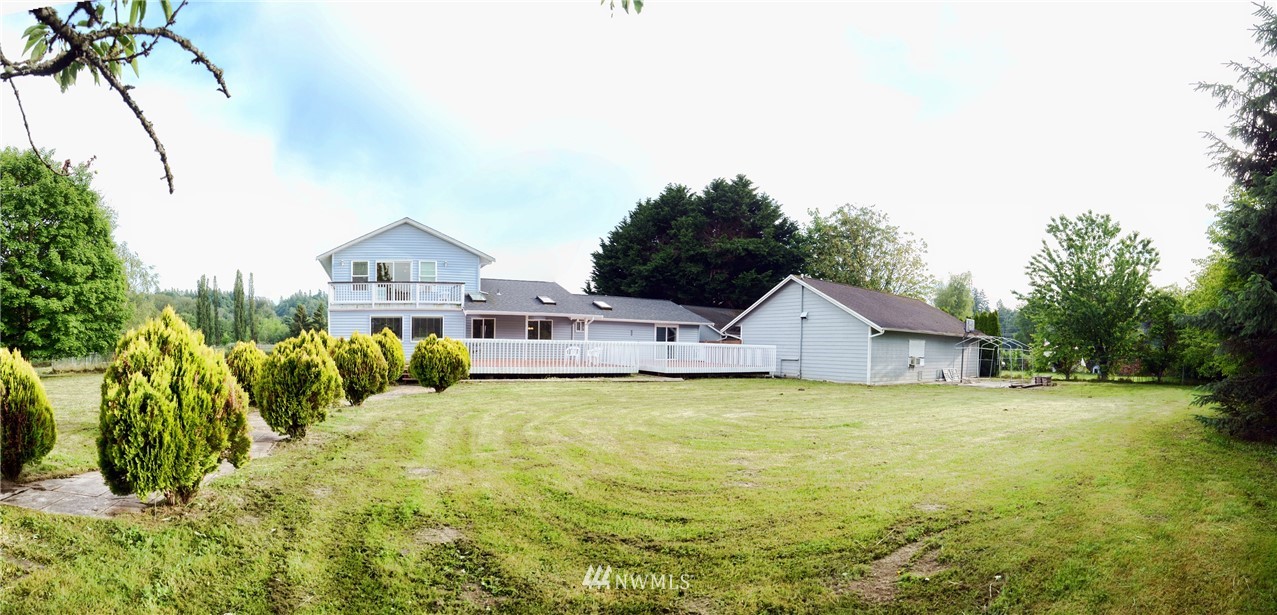 1024 South Machias Road Snohomish, WA 98290 - Photo 34 of 36 a house that has a big yard with plants and large trees