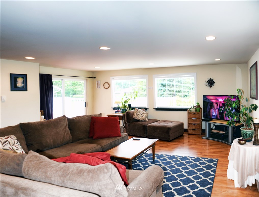 1024 South Machias Road Snohomish, WA 98290 - Photo 9 of 36 a living room with furniture and a flat screen tv