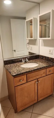 a lake view with a bench and trees