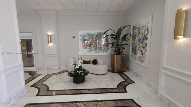 a outdoor space with lots of white furniture and glass windows