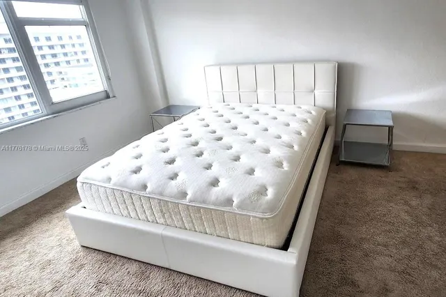 a view of a bedroom with window