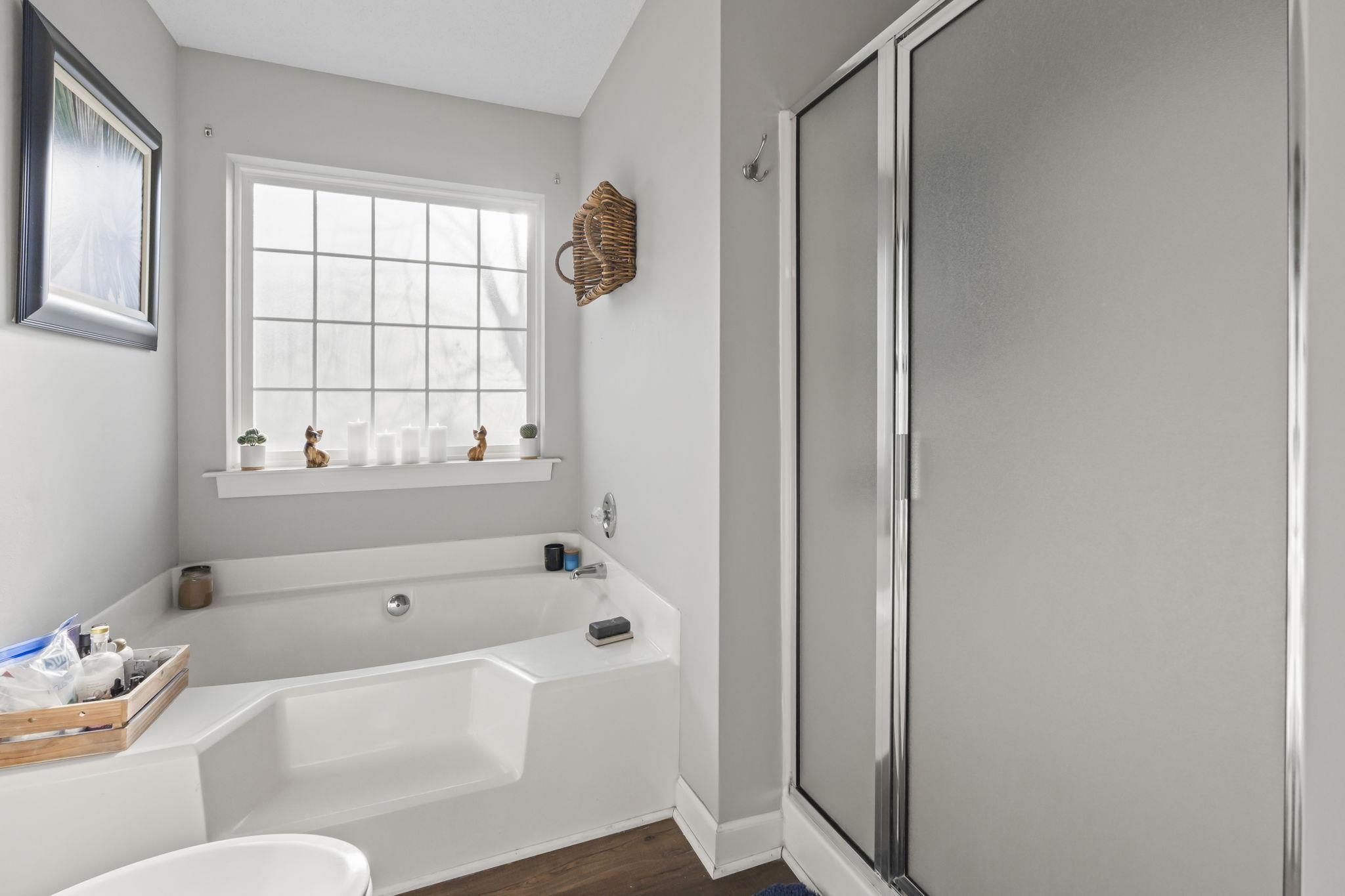 4383 Daphne Lane, Unit F Murrells Inlet, SC 29576 - Photo 25 of 35 Full bath featuring a shower stall, a garden tub, and dark wood-style flooring