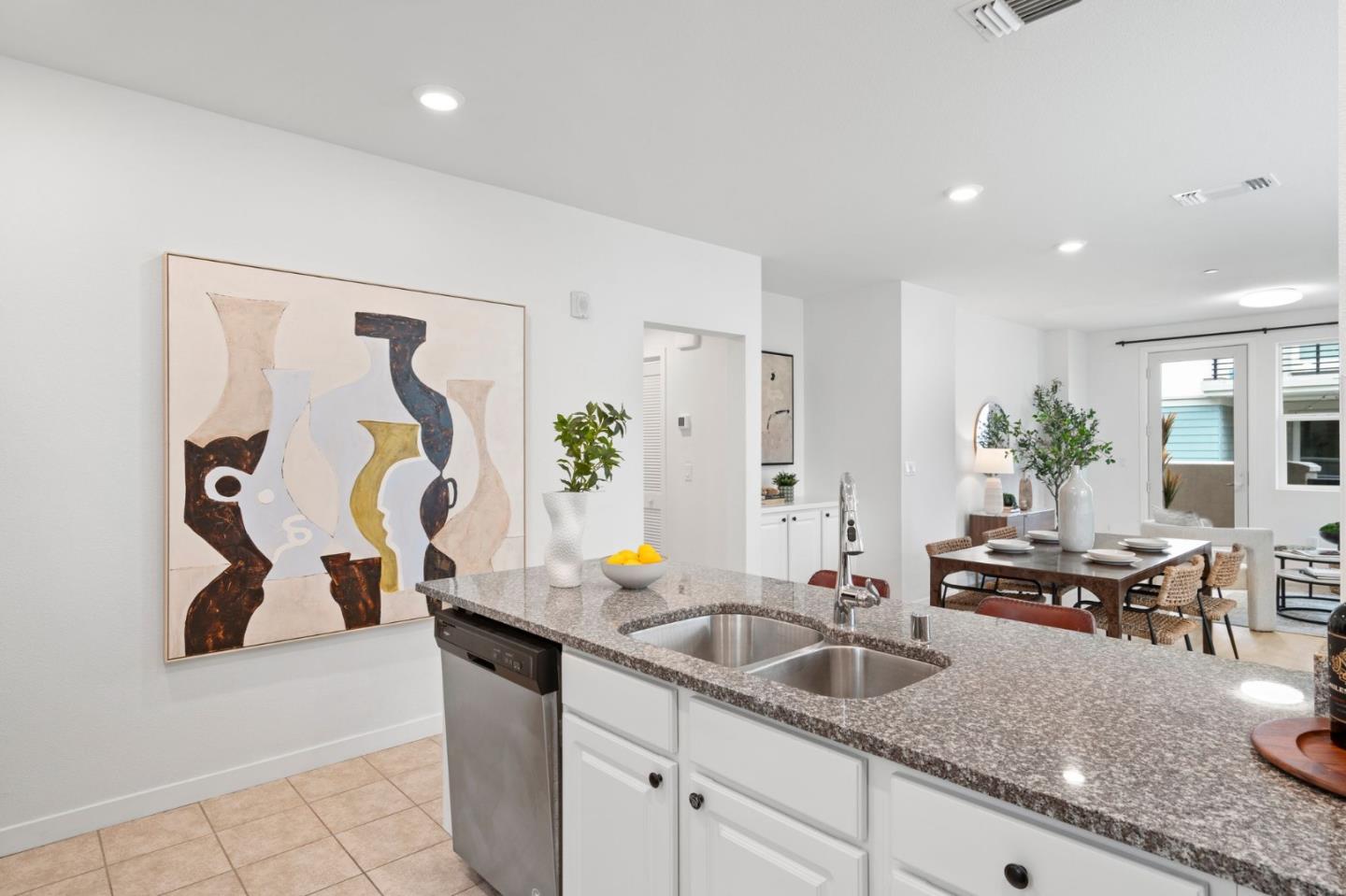 1419 Lavender Loop Milpitas, CA 95035 - Photo 11 of 38 a kitchen with stainless steel appliances granite countertop a sink and a granite counter tops