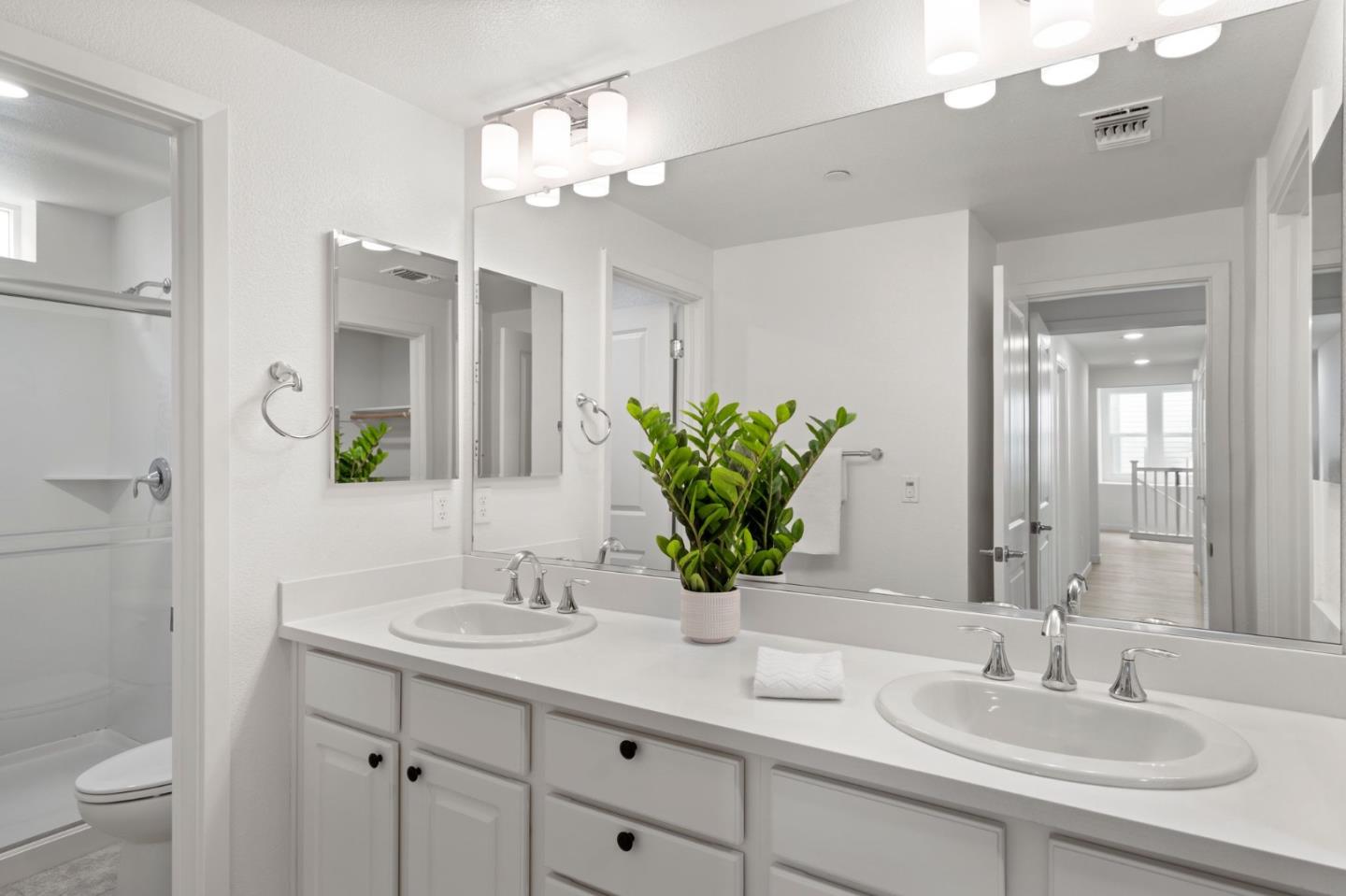 1419 Lavender Loop Milpitas, CA 95035 - Photo 29 of 38 a bathroom with a sink double vanity and a mirror