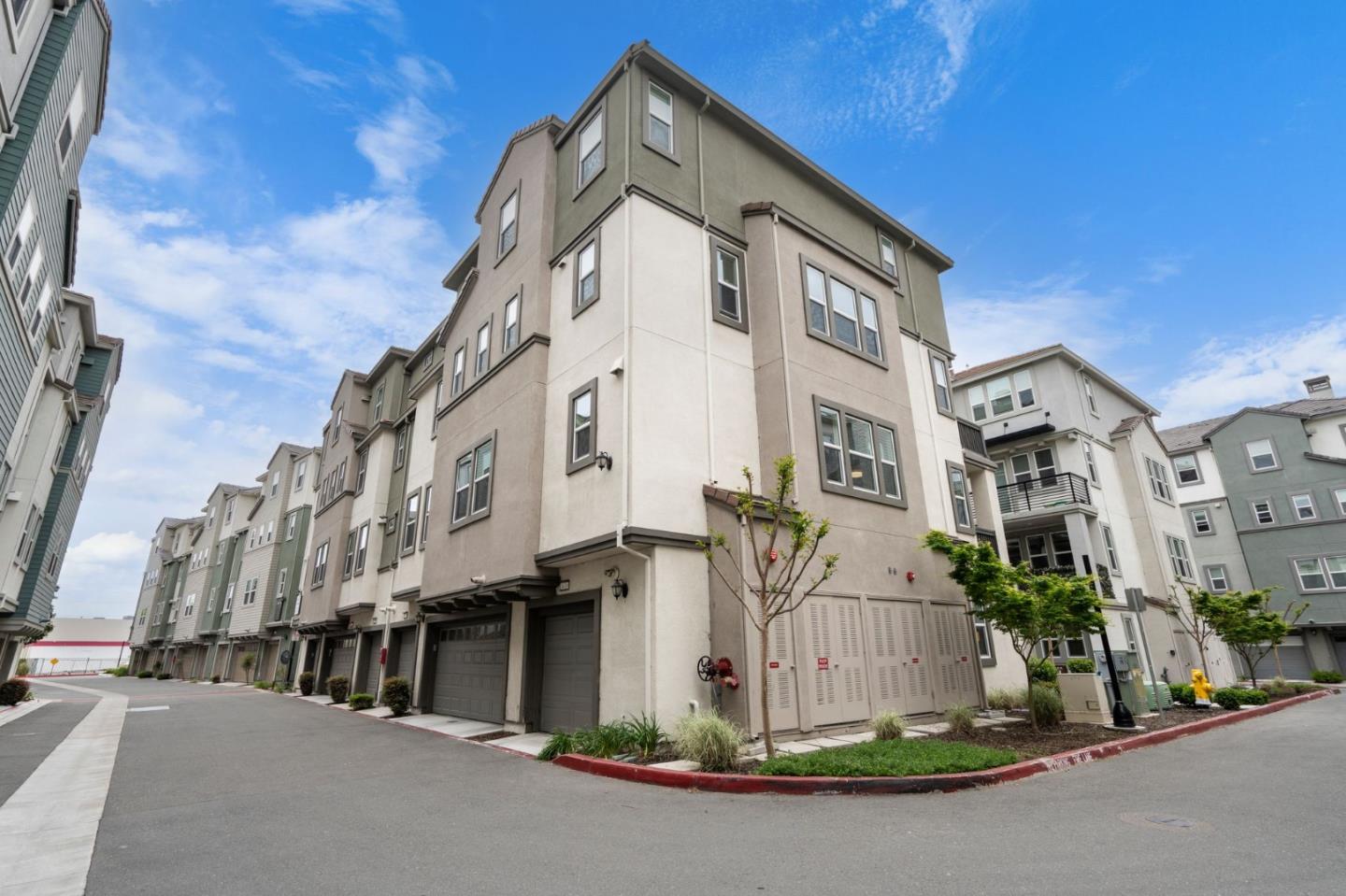 1419 Lavender Loop Milpitas, CA 95035 - Photo 32 of 38 a front view of a building with a street