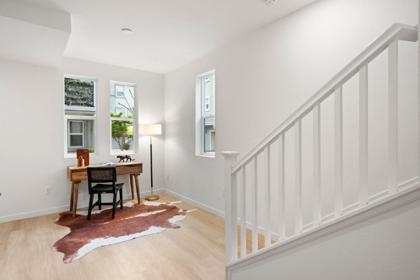 1419 Lavender Loop Milpitas, CA 95035 - Photo 4 of 38 a workspace with wooden floor and a window