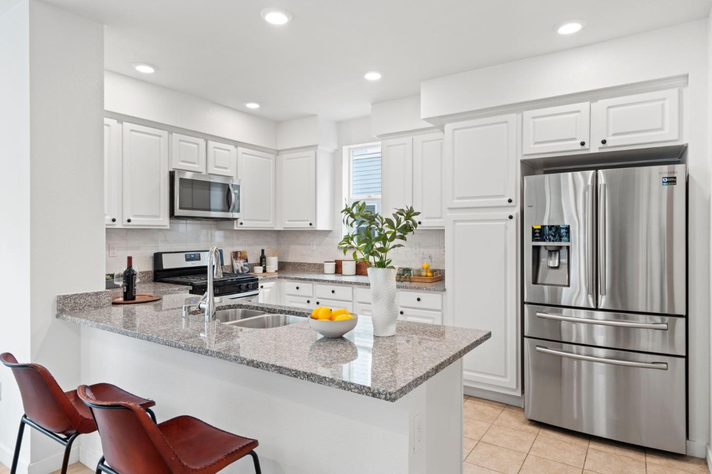 1419 Lavender Loop Milpitas, CA 95035 - Photo 8 of 38 a kitchen with stainless steel appliances granite countertop a refrigerator a sink and a stove