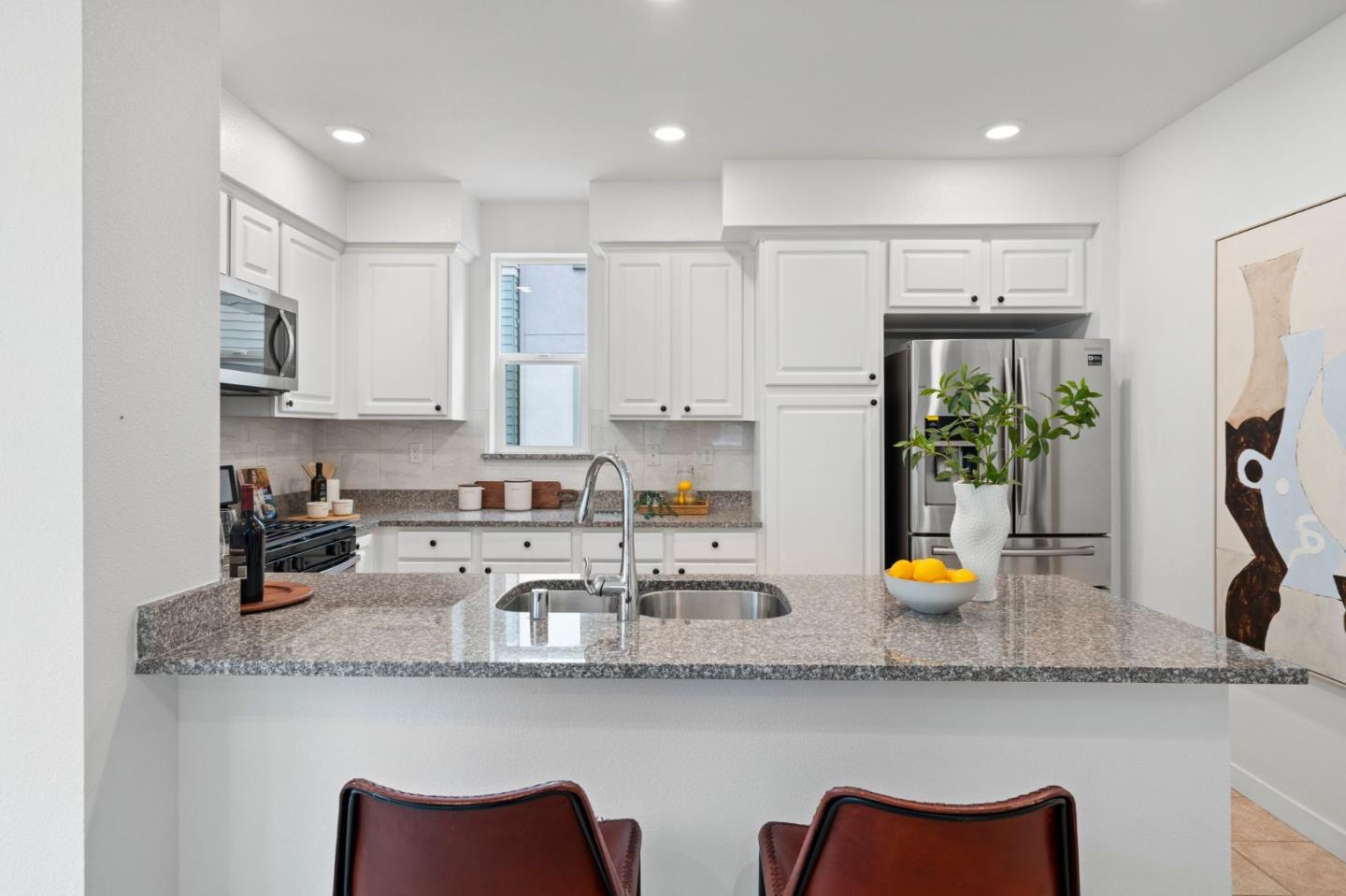 1419 Lavender Loop Milpitas, CA 95035 - Photo 9 of 38 a kitchen with stainless steel appliances granite countertop a sink and cabinets