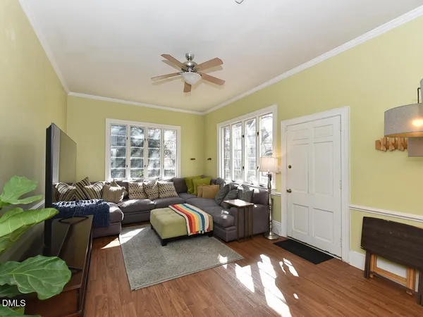 a kitchen that has a sink a stove and a window