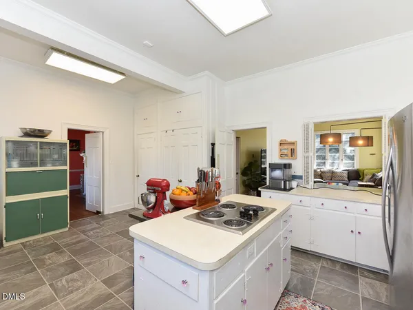 a bedroom with a bed a window and glass door