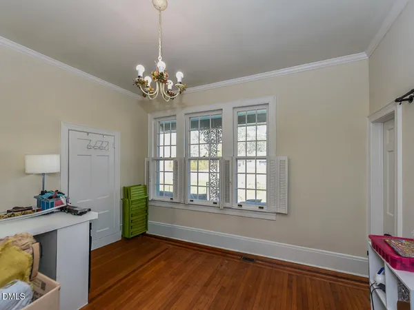 a view of a patio with table and chairs and potted plants