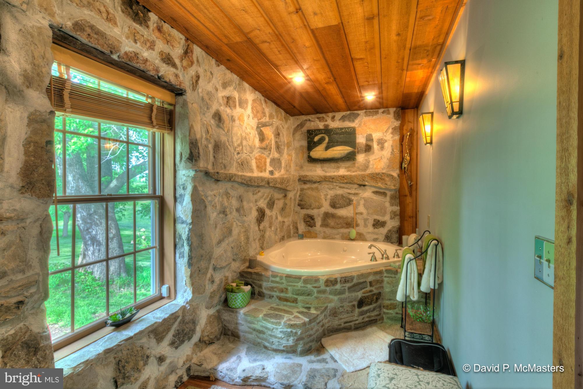 3735 Summit Point Road Charles Town, WV 25414 - Photo 13 of 27 Master ba. Original stone walls expertly matched