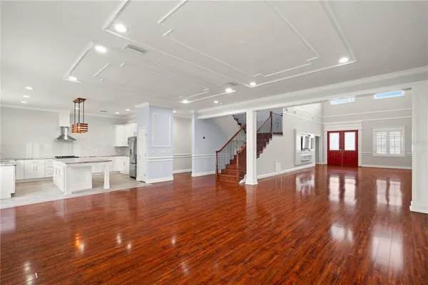 a view of kitchen with cabinets and wooden floor