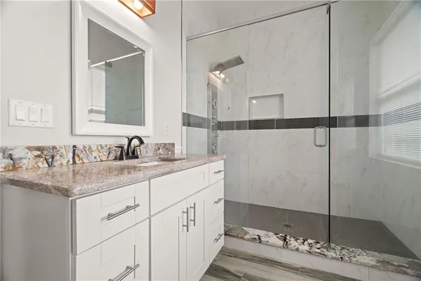 a bathroom with a sink and a mirror