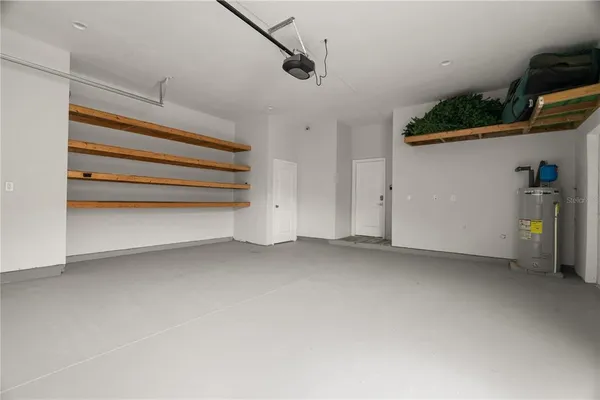 a view of room with stairs and a ceiling fan