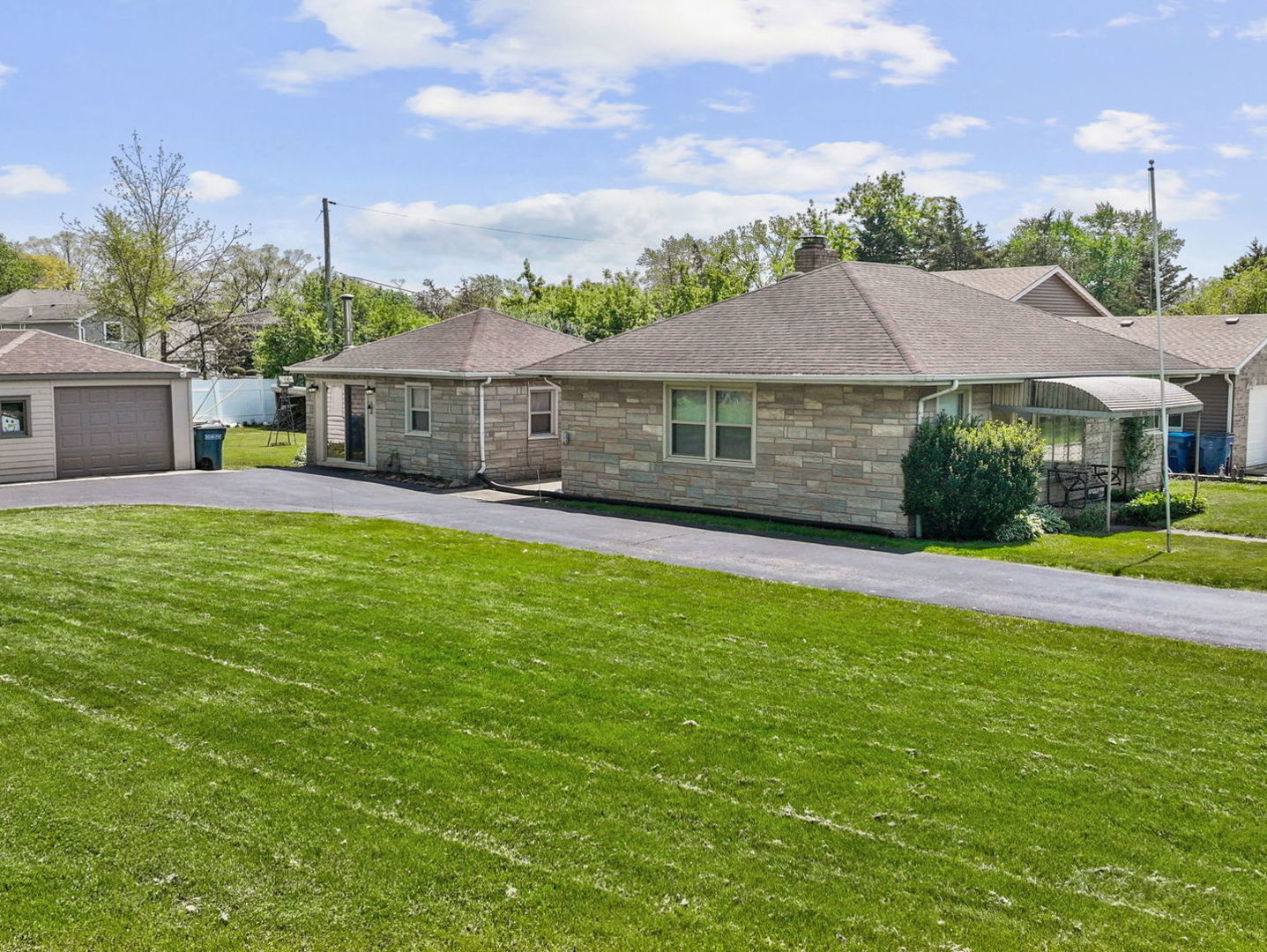 4N365 9th Avenue Addison, IL 60101 - Photo 21 of 24 a view of a house with a big yard and potted plants