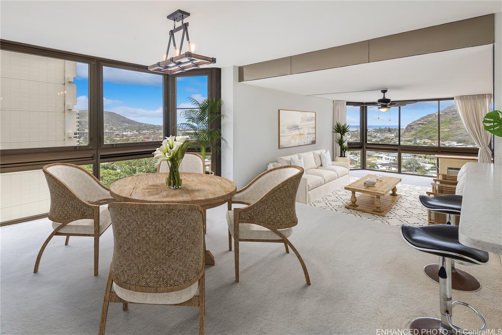 Enhanced. Virtually staged main living space with mountain, marina and ocean views.