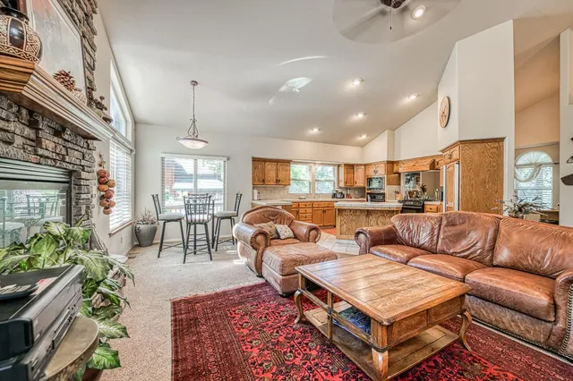 a living room with furniture and a piano