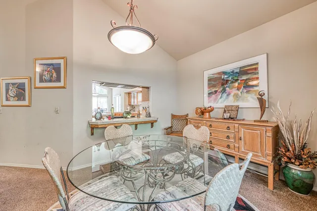 a bed room with a bed and a chandelier