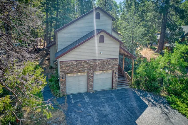 a view of a lush green outdoor space with a lake view and mountain view