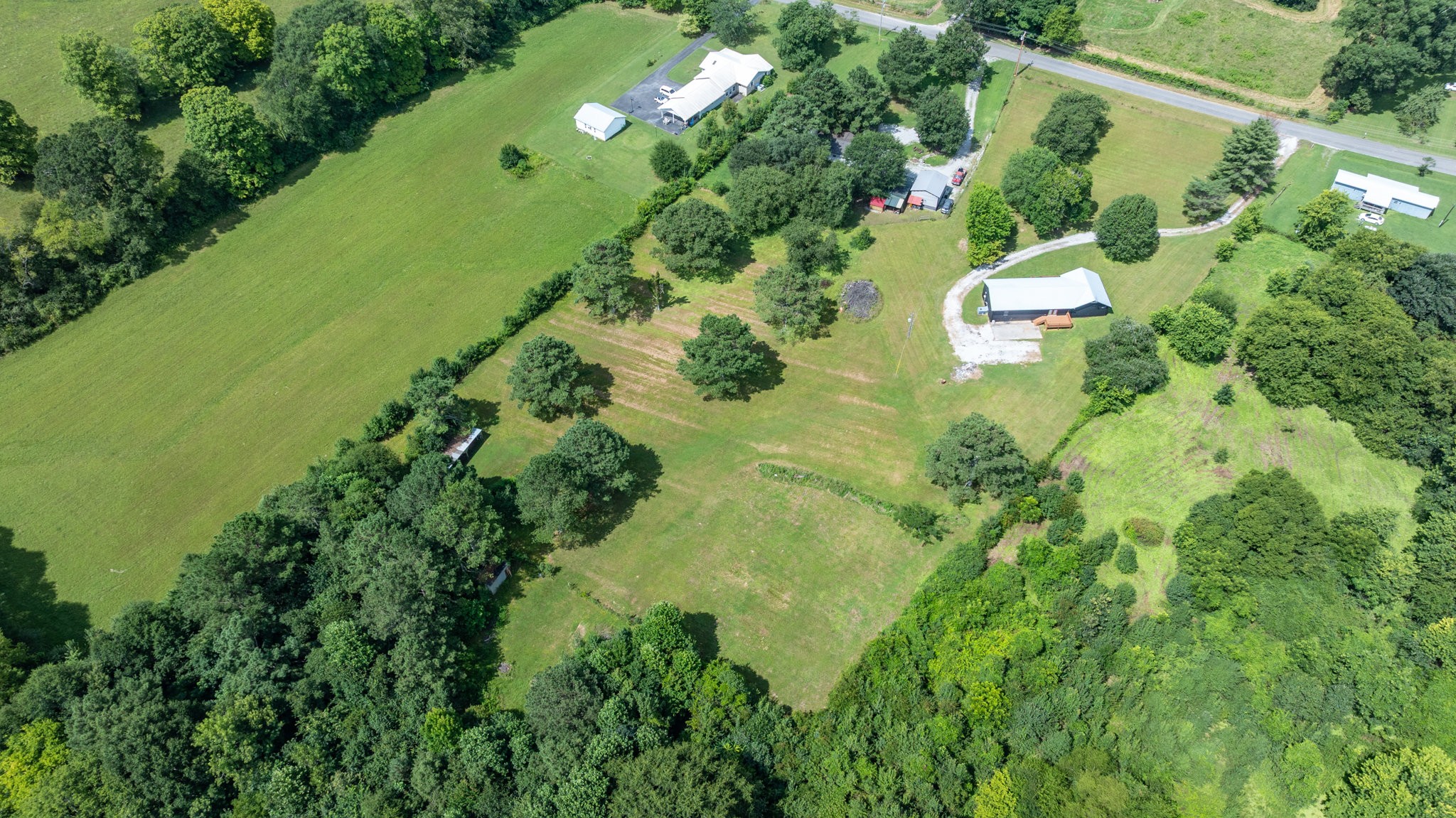 340 Old Spring Creek Road Estill Springs, TN 37330 - Photo 46 of 60 an aerial view of a residential houses with outdoor space and trees all around