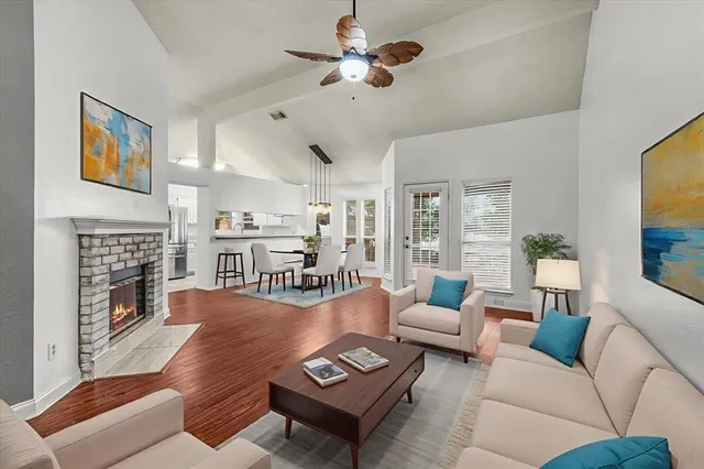 a living room with furniture fireplace and a flat screen tv