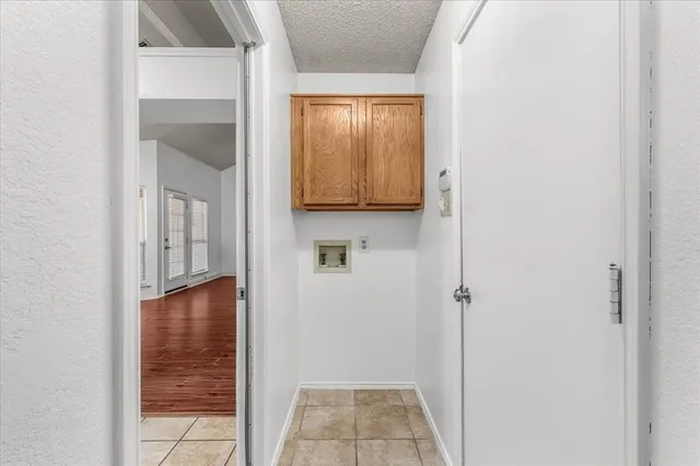 a view of room with window and front door