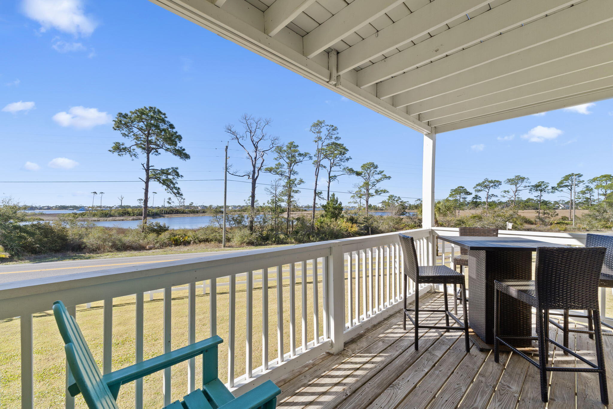 16020 Innerarity Point Road Pensacola, FL 32507 - Photo 12 of 38 a view of a chairs and table in the balcony