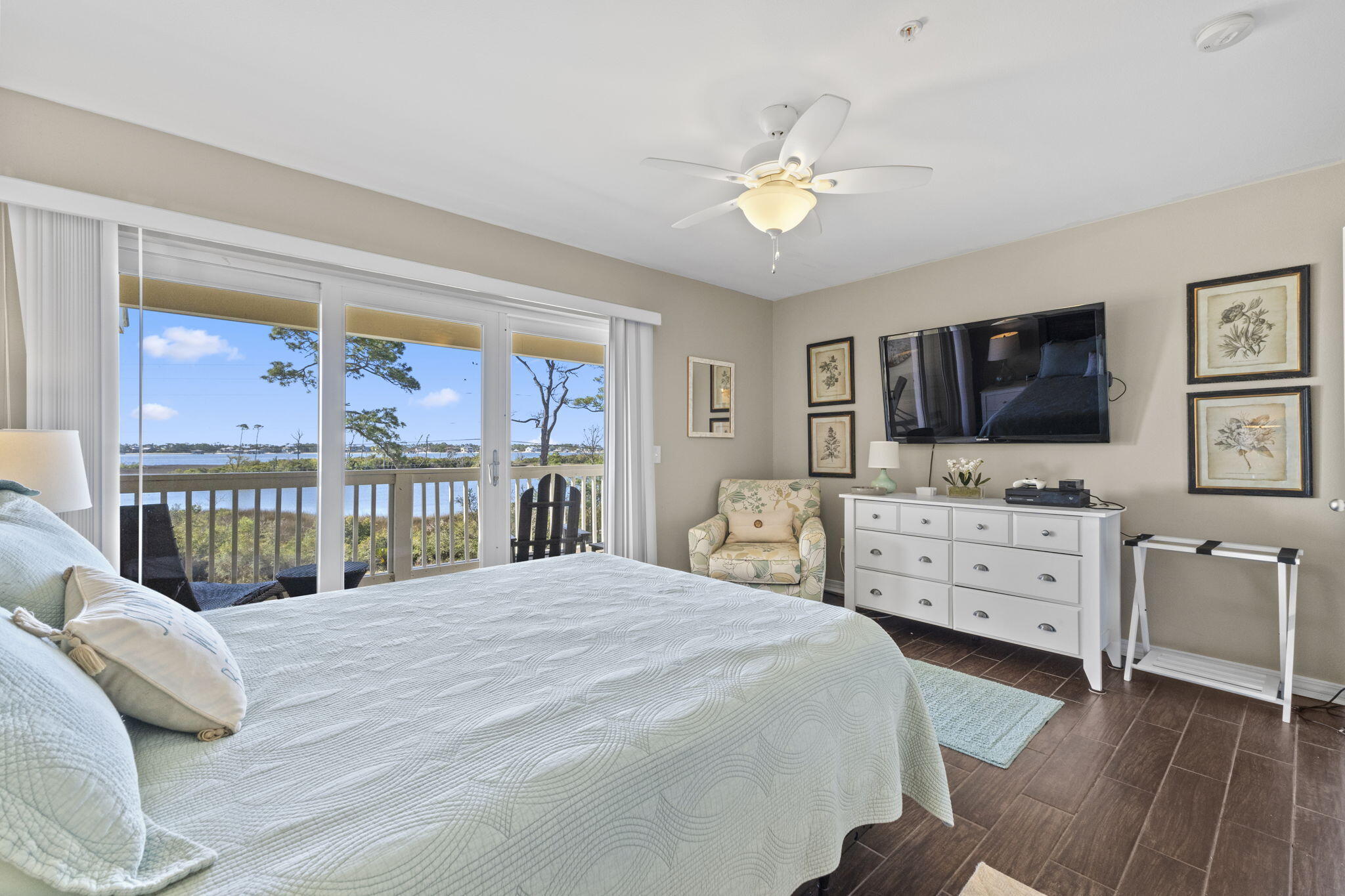 16020 Innerarity Point Road Pensacola, FL 32507 - Photo 16 of 38 a bedroom with a bed and a flat screen tv