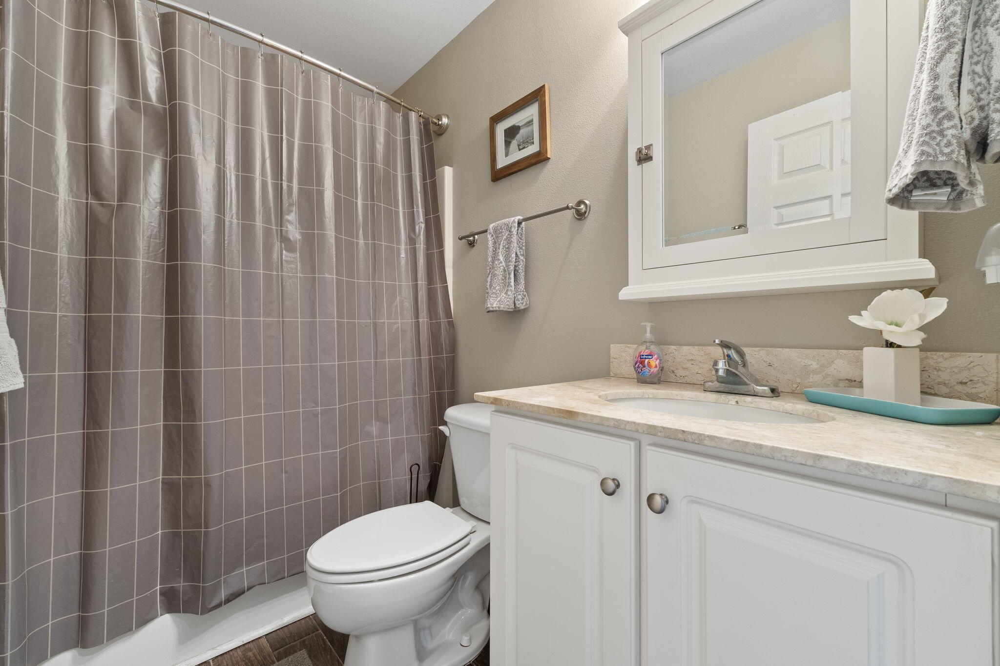 16020 Innerarity Point Road Pensacola, FL 32507 - Photo 21 of 38 a bathroom with a granite countertop toilet sink and mirror