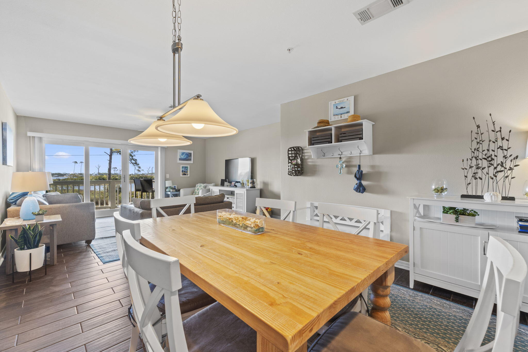 16020 Innerarity Point Road Pensacola, FL 32507 - Photo 3 of 38 a room with stainless steel appliances kitchen island a table and chairs