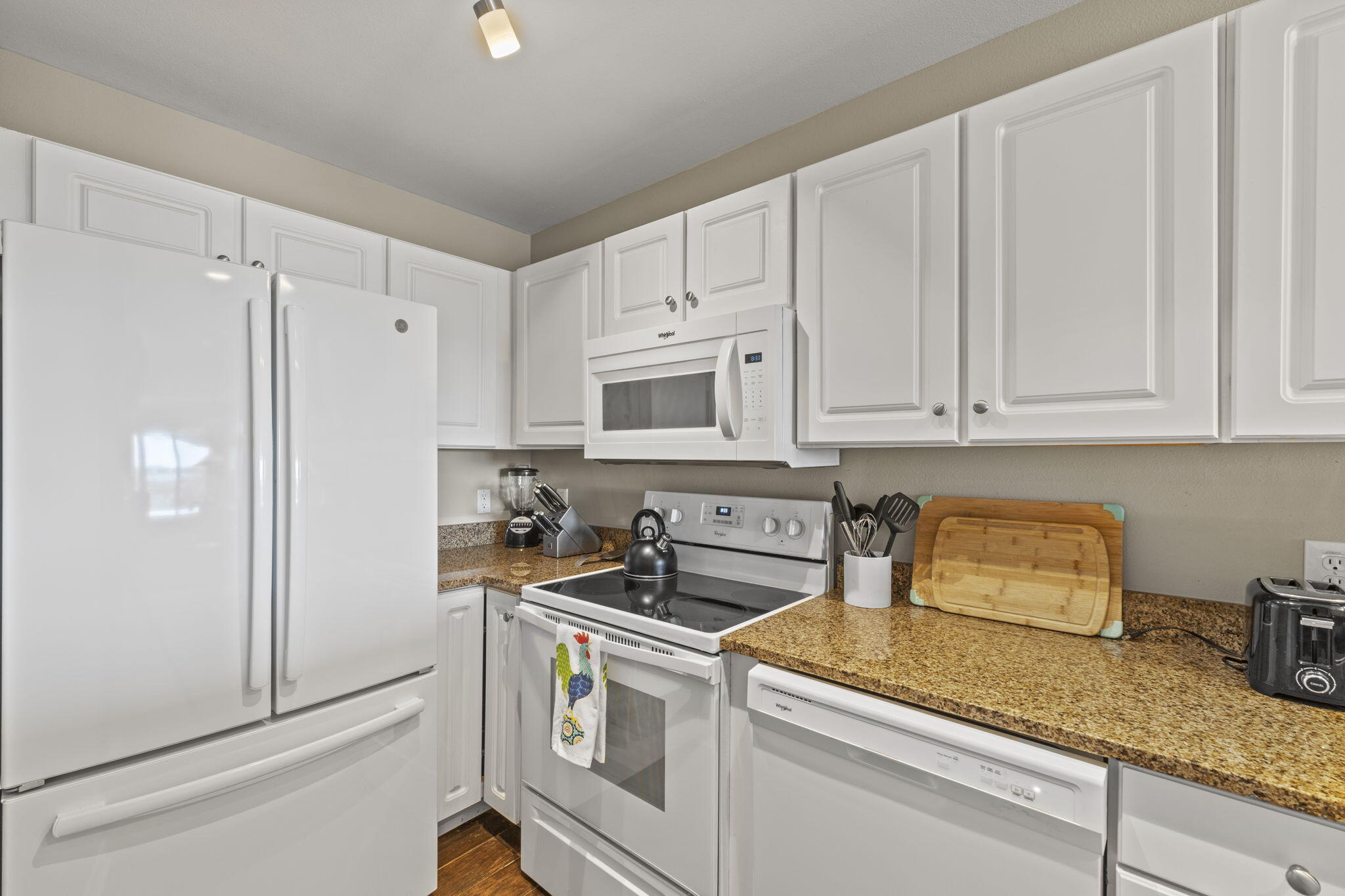 16020 Innerarity Point Road Pensacola, FL 32507 - Photo 8 of 38 a kitchen with granite countertop white cabinets and white appliances
