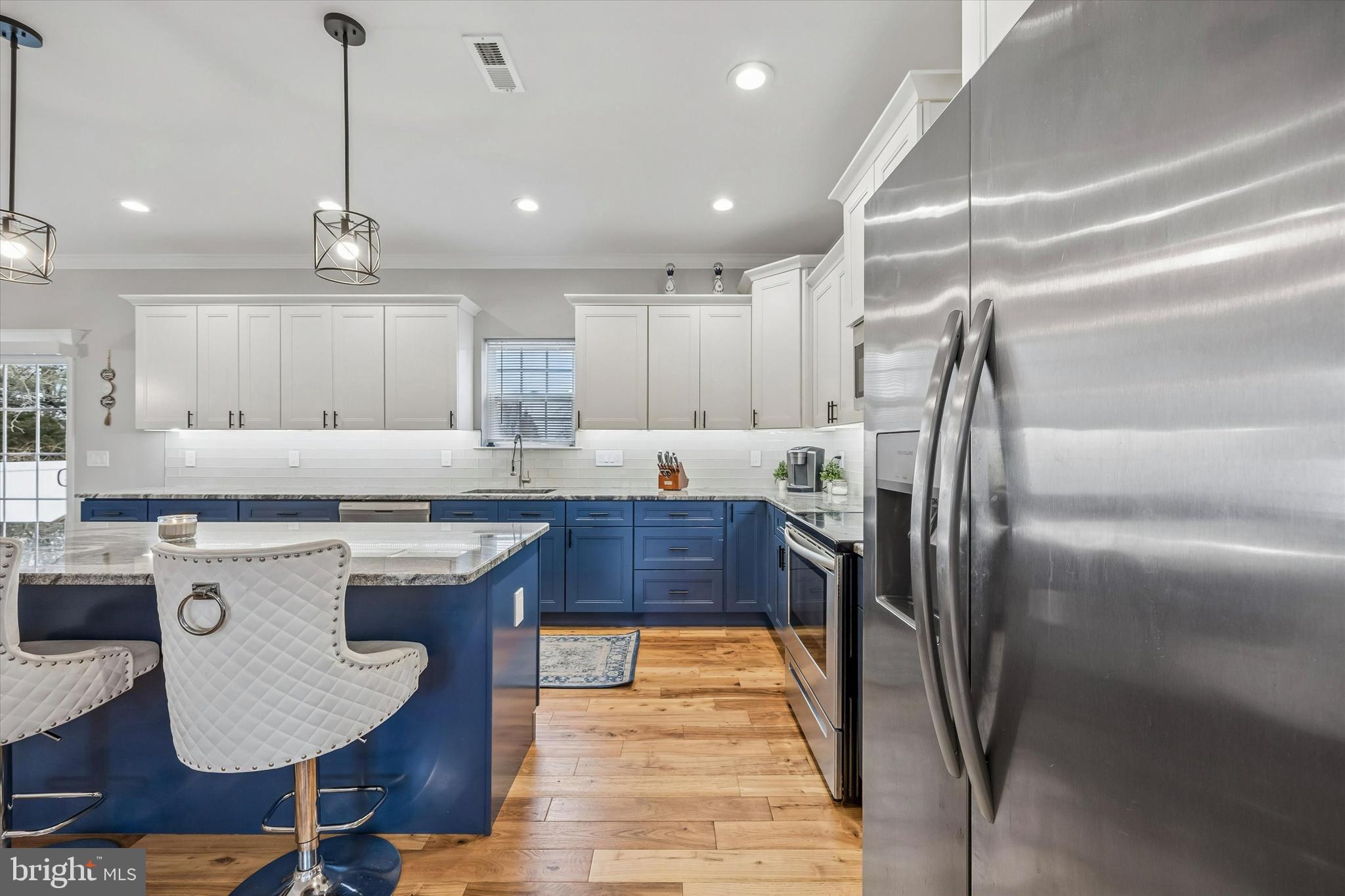 709 Shadyside Avenue Croydon, PA 19021 - Photo 14 of 40 a kitchen with kitchen island a counter top space appliances and cabinets