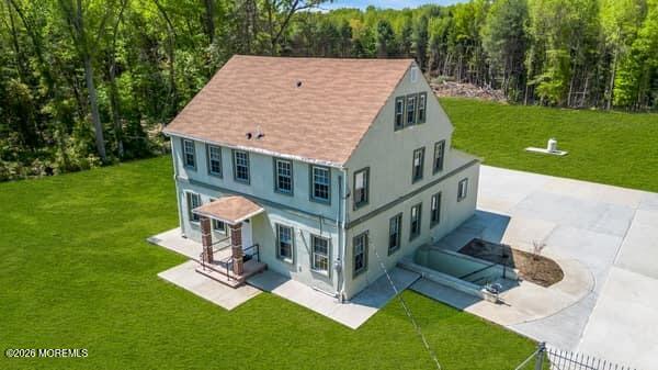 141 Arneys Mt Road Pemberton, NJ 08068 - Photo 4 of 29 a aerial view of a house with a yard table and chairs