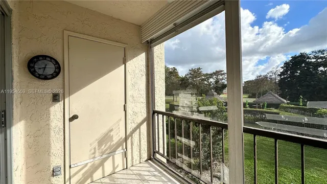 a view of a balcony with wooden floor