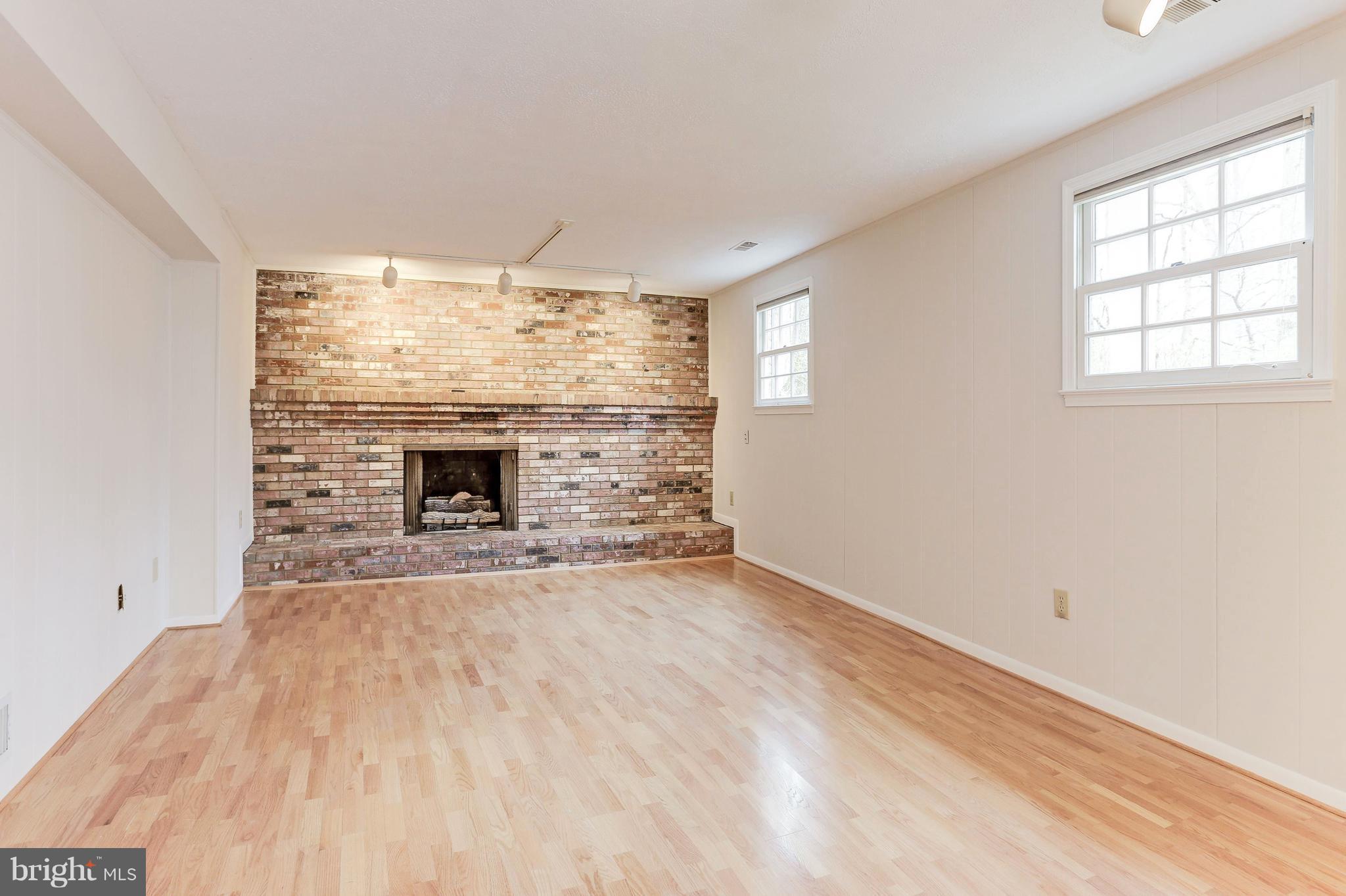 12004 Canter Lane Reston, VA 20191 - Photo 22 of 30 Family Room Lower Level w/ beautiful gas fireplace