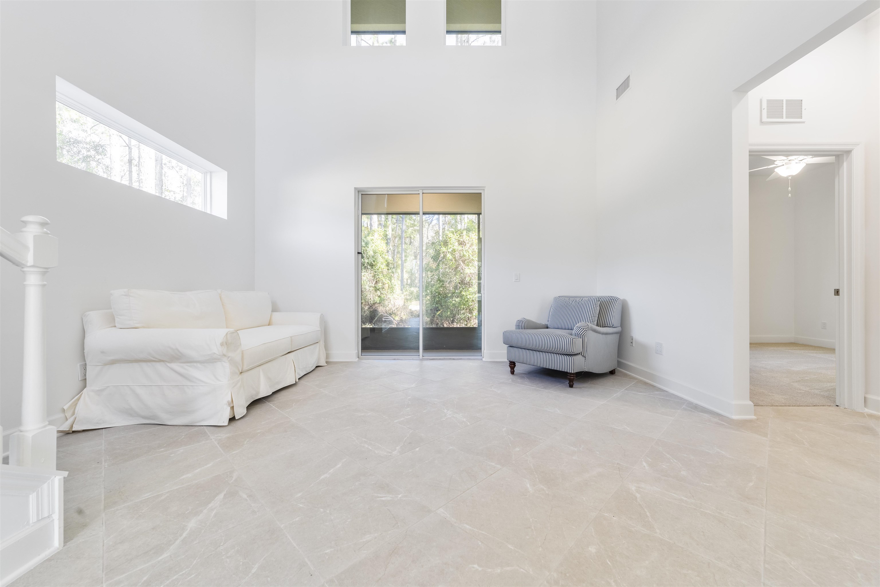 272 Grand Ravine Drive St. Augustine, FL 32086 - Photo 11 of 41 a living room with furniture and a large window