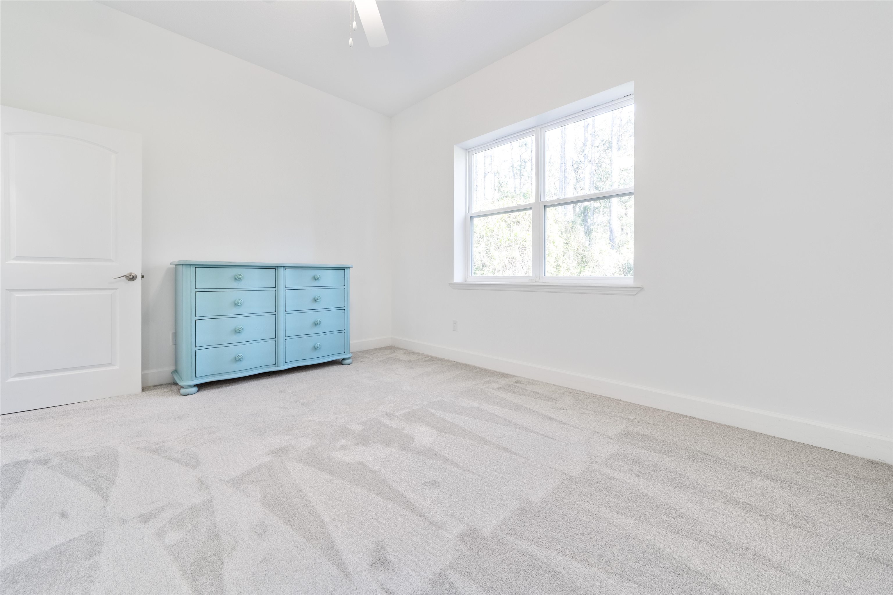 272 Grand Ravine Drive St. Augustine, FL 32086 - Photo 15 of 41 an empty room with windows and cabinet