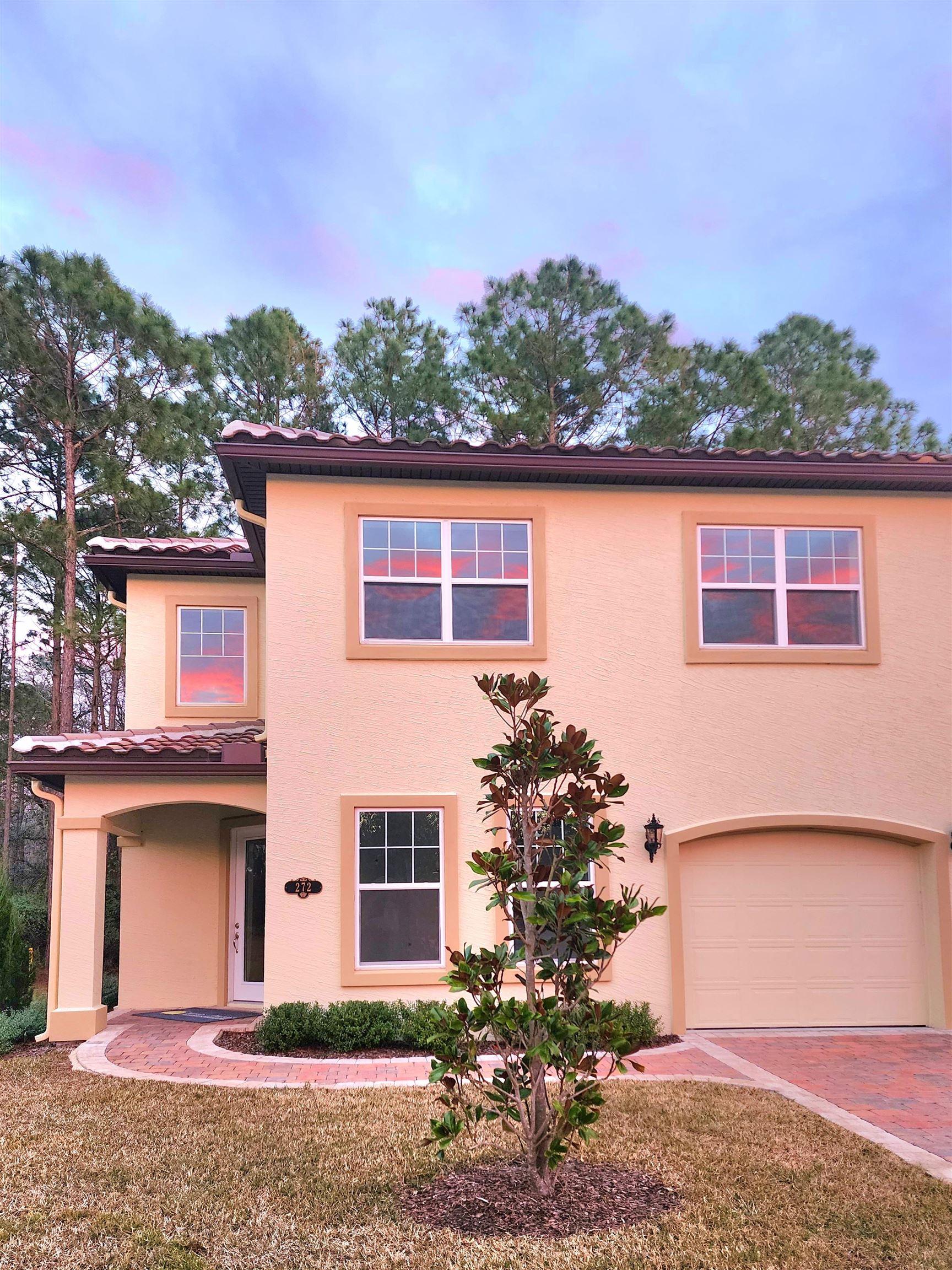 272 Grand Ravine Drive St. Augustine, FL 32086 - Photo 2 of 41 a front view of a house with a yard and garage