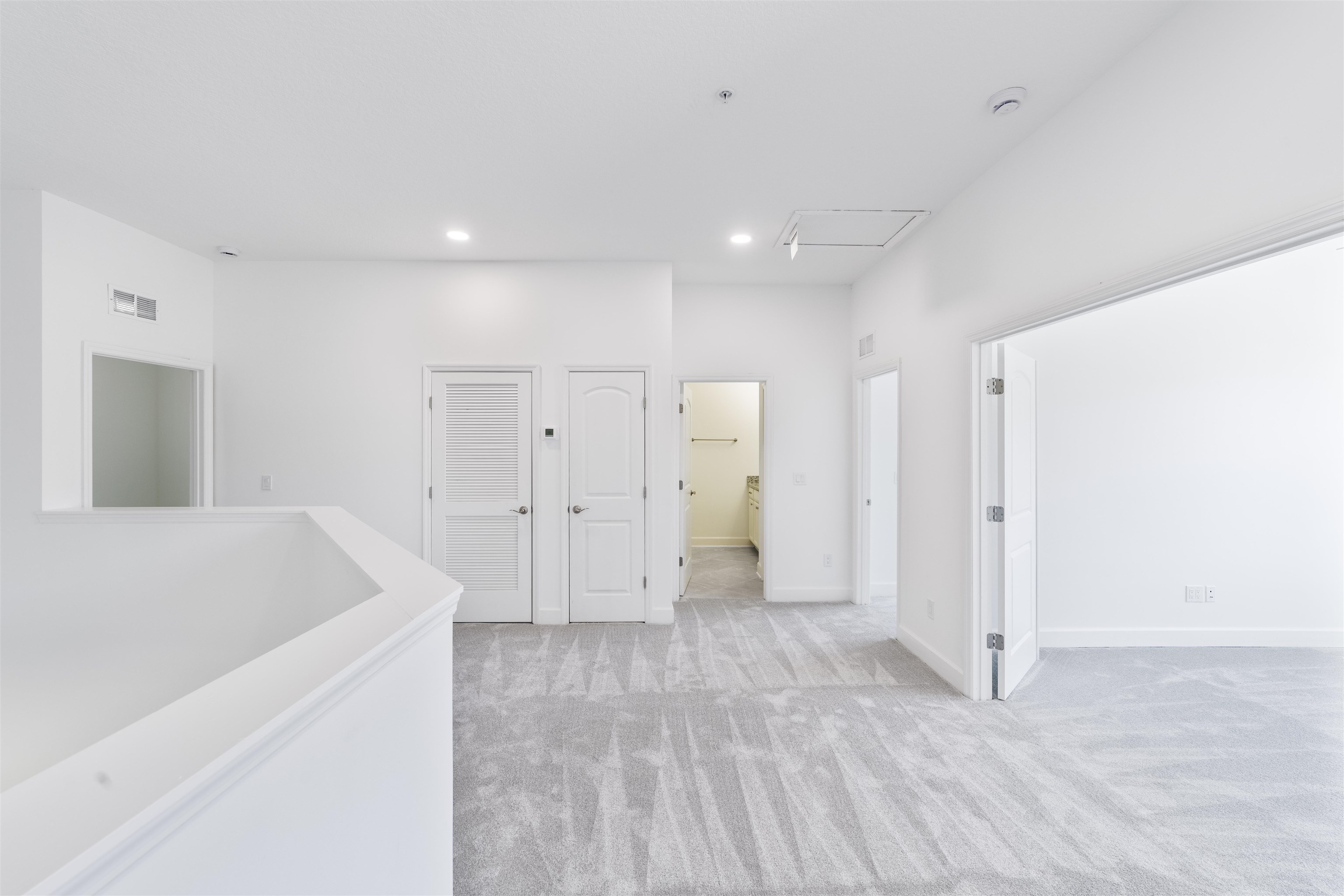272 Grand Ravine Drive St. Augustine, FL 32086 - Photo 24 of 41 a view of a kitchen cabinets and a hallway