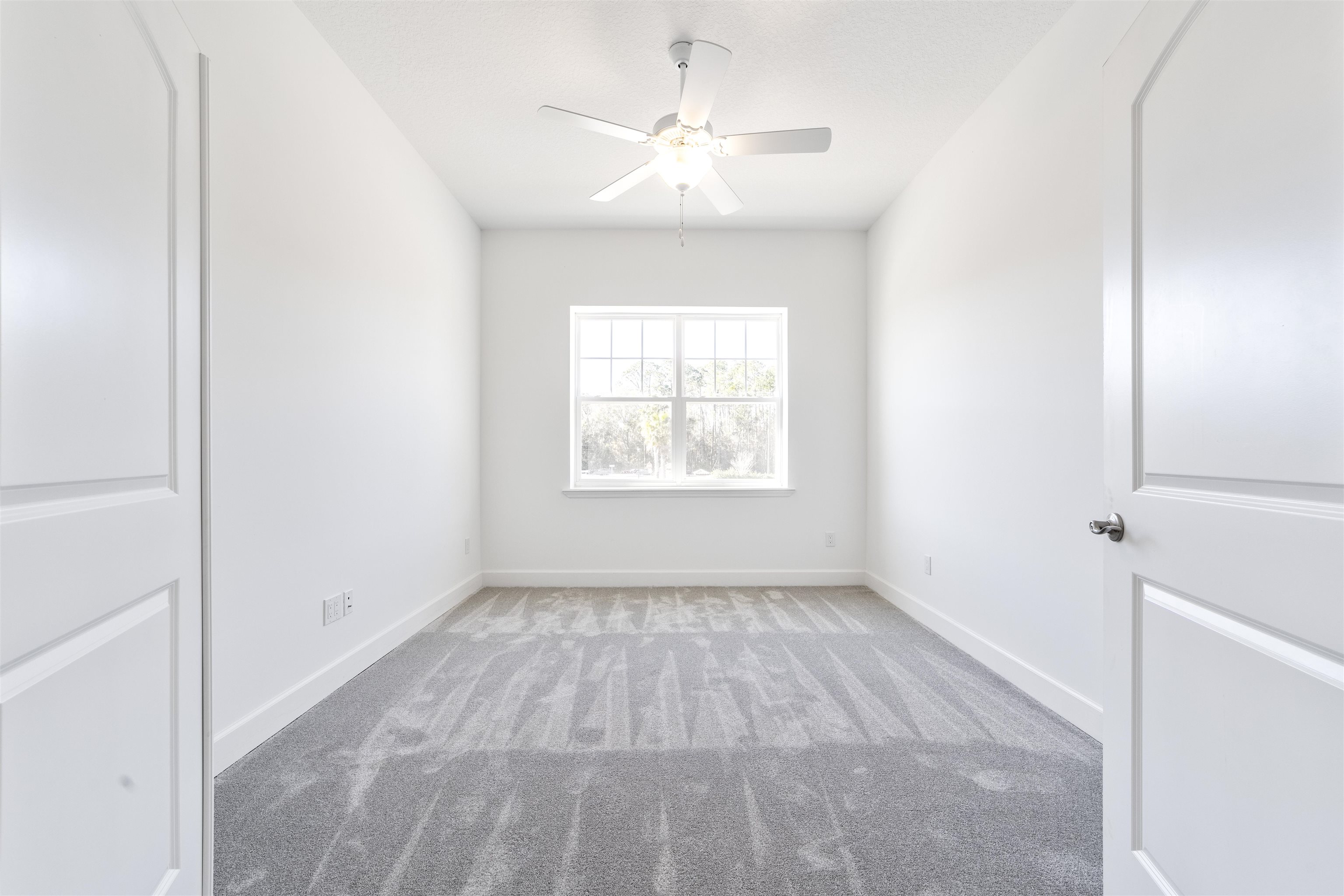 272 Grand Ravine Drive St. Augustine, FL 32086 - Photo 25 of 41 an empty room with windows and fan