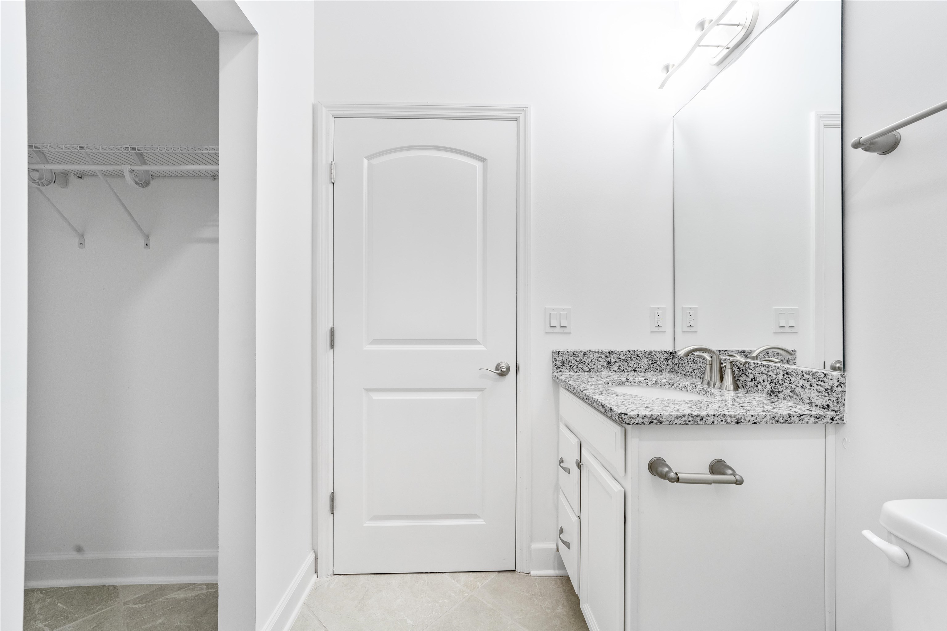 272 Grand Ravine Drive St. Augustine, FL 32086 - Photo 32 of 41 a bathroom with a granite countertop sink and a mirror