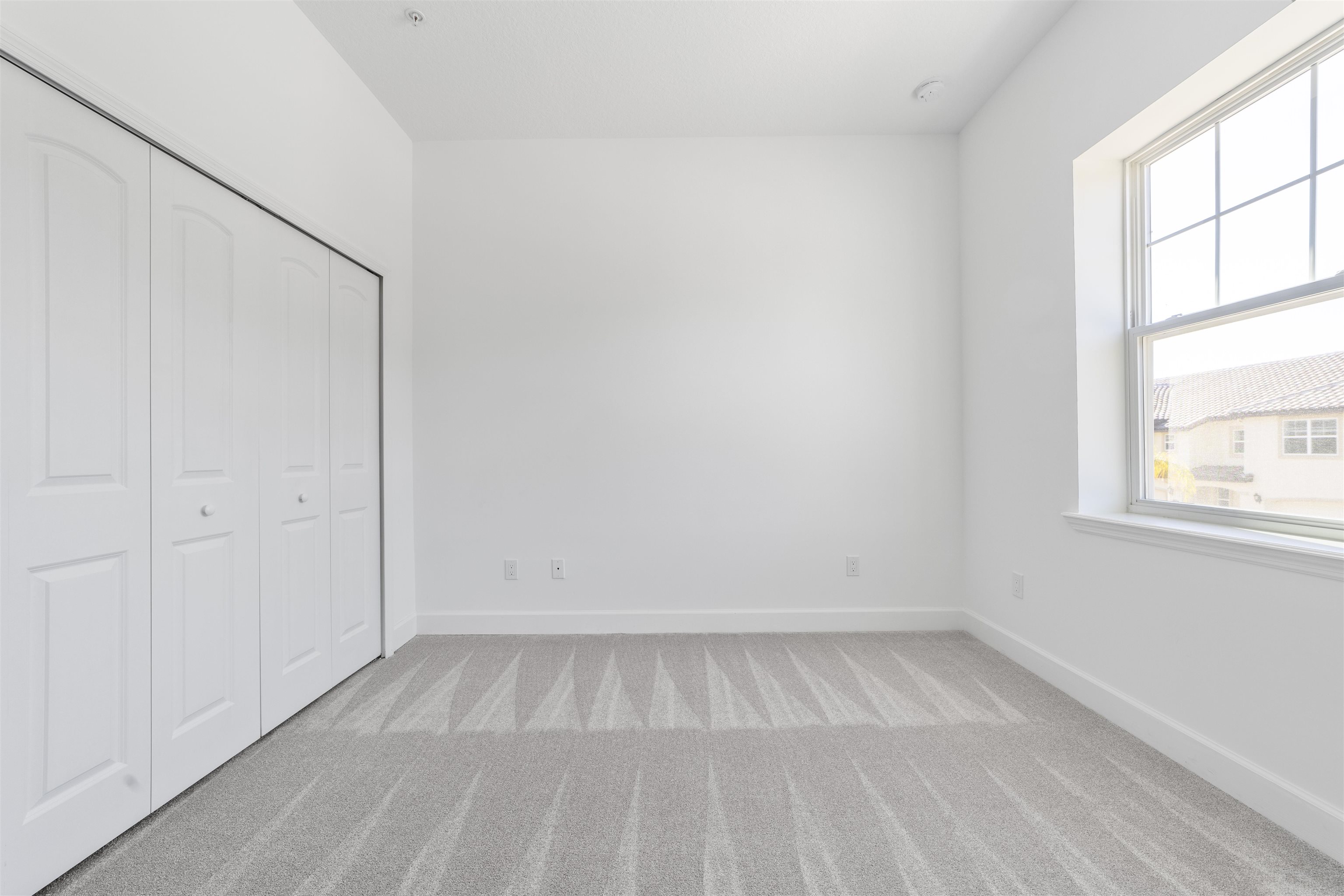 272 Grand Ravine Drive St. Augustine, FL 32086 - Photo 35 of 41 an empty room with a white walls and a window