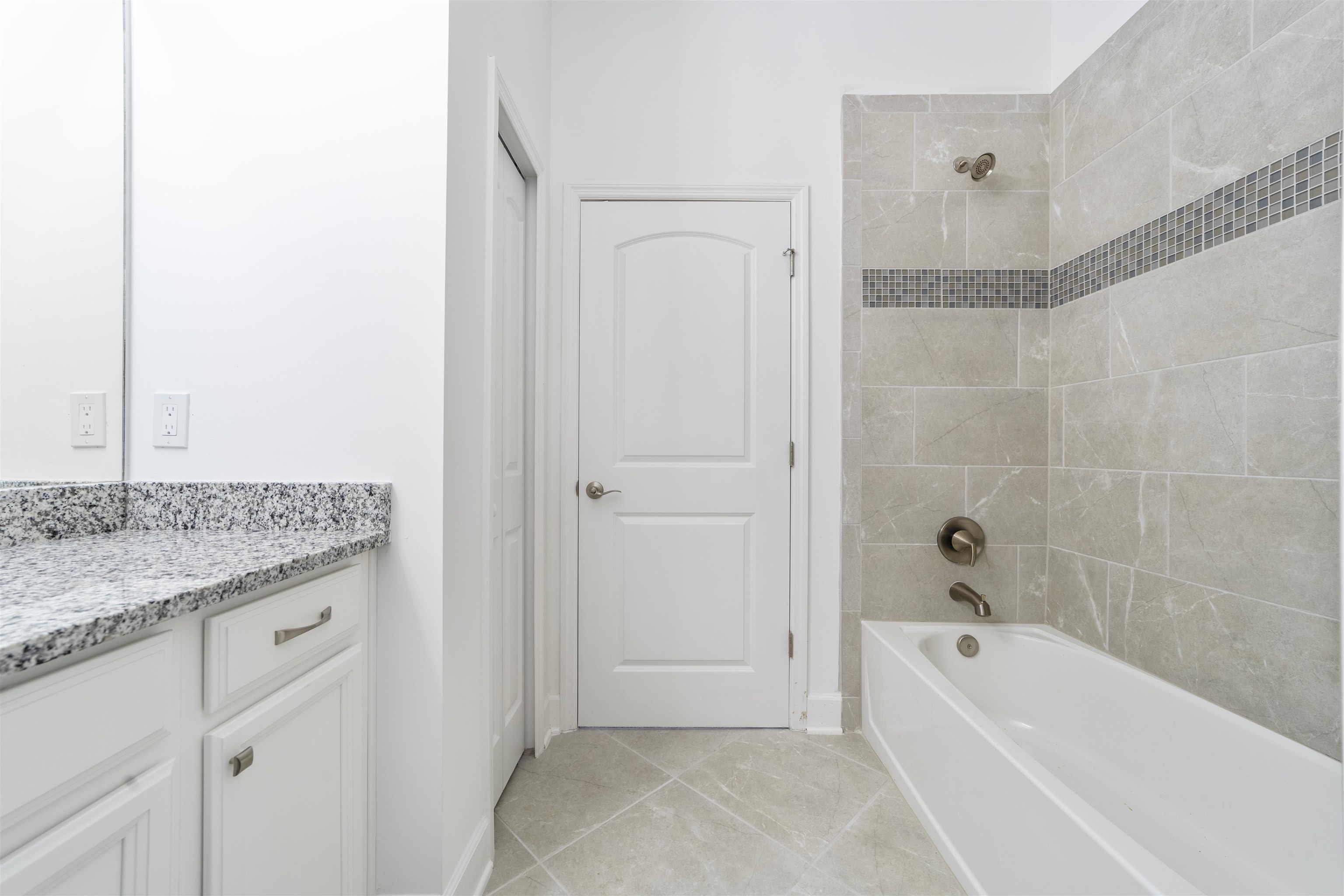 272 Grand Ravine Drive St. Augustine, FL 32086 - Photo 36 of 41 a bathroom with a granite countertop sink a mirror bathtub and shower