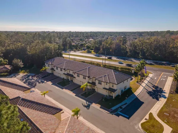 an aerial view of a house with a ocean view